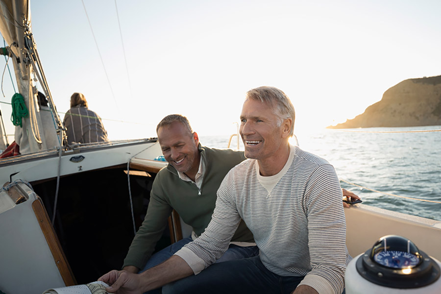 men sitting on boat