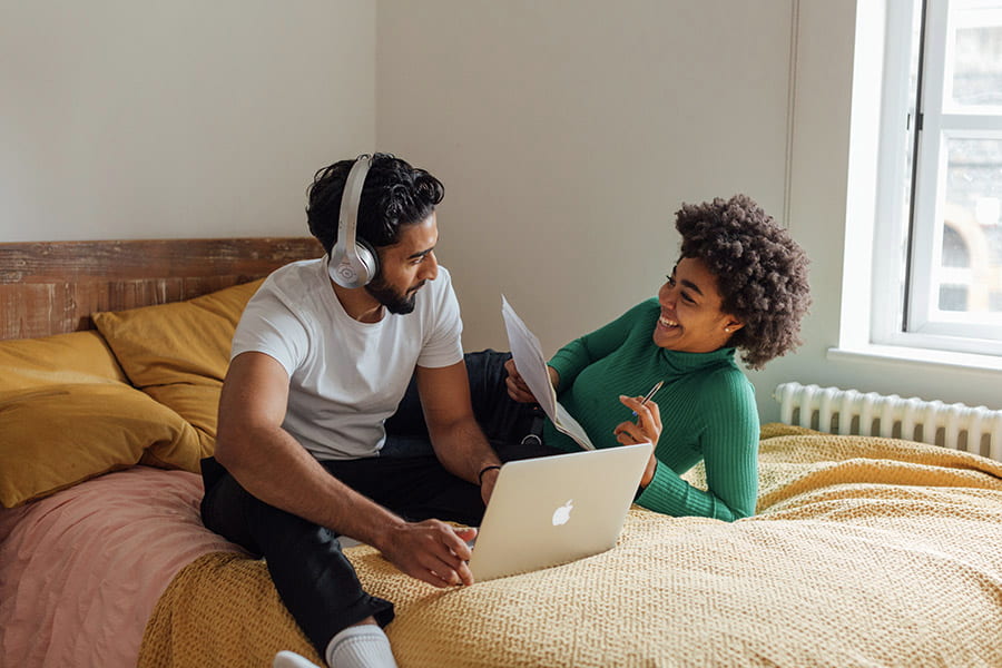 couple talking on bed