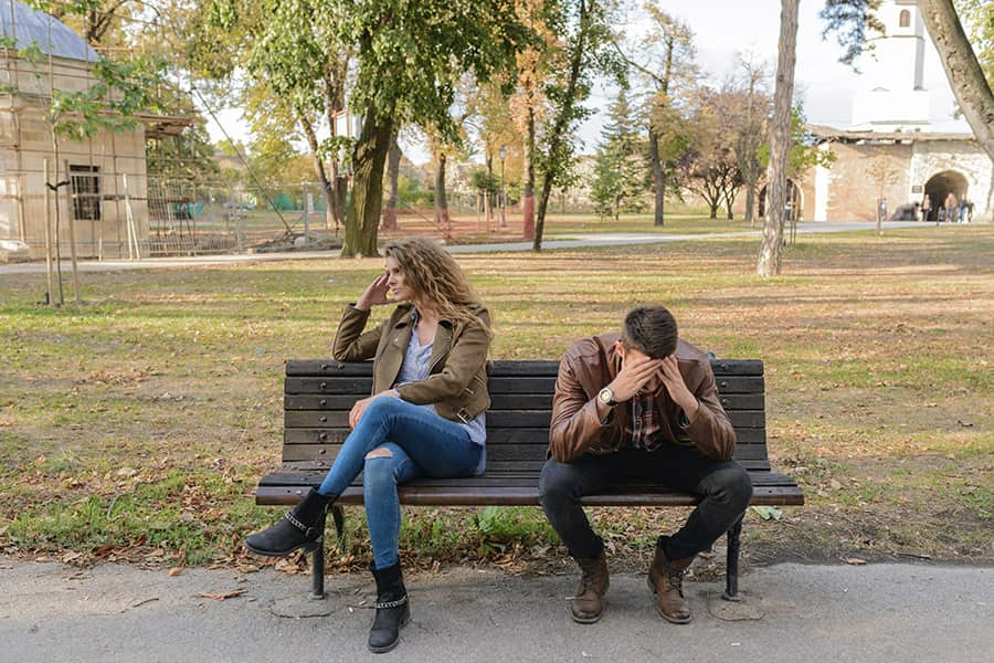 couple sitting on bench