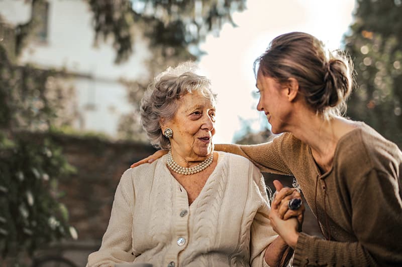 elderly woman talking to granddaughter