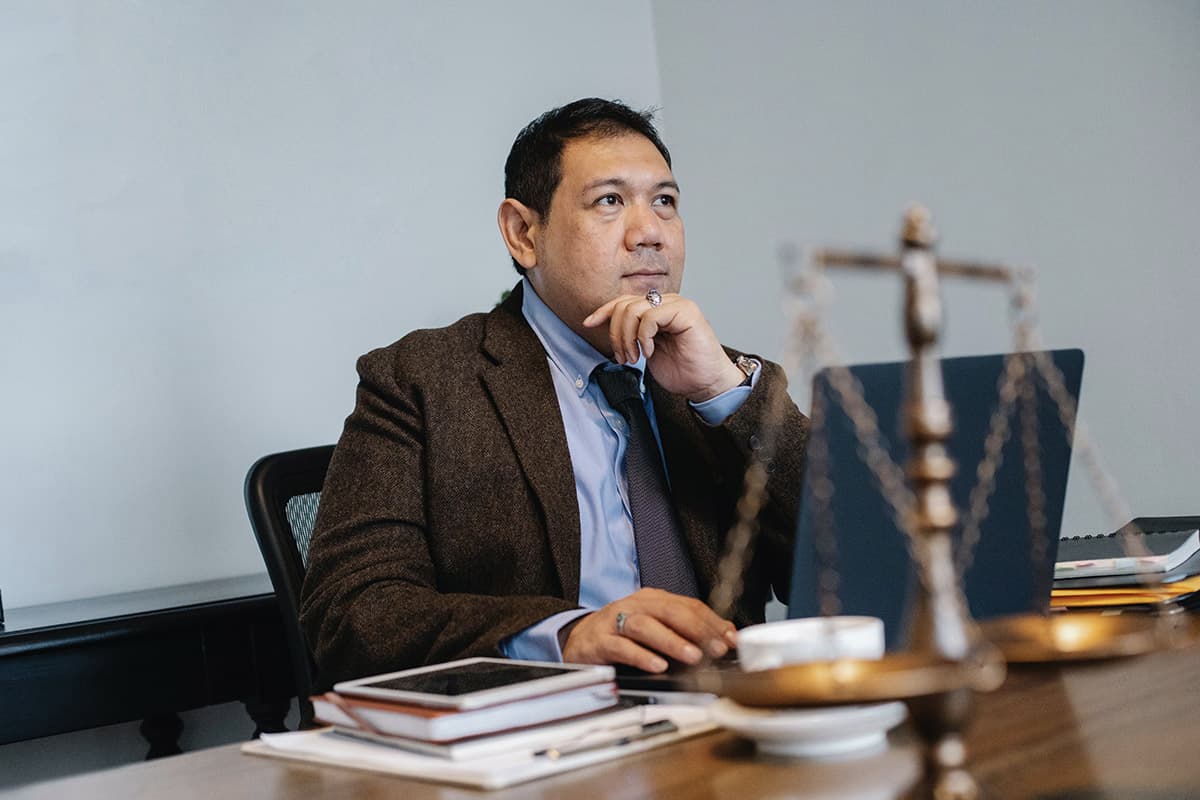 man at desk with vintage scale