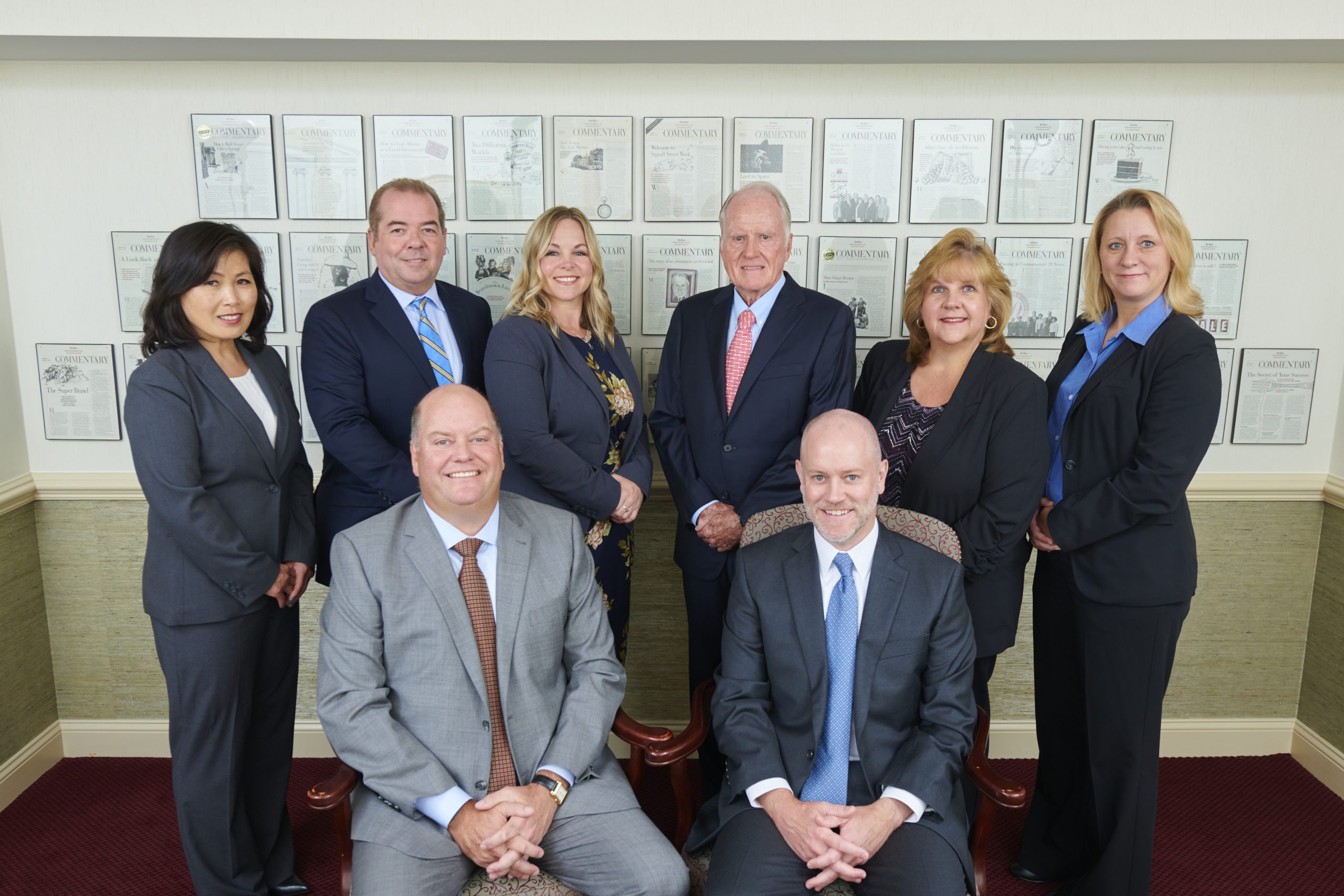 Investment advisors and other McRae staffers pose for a staff picture and celebrate the McRae anniversary.